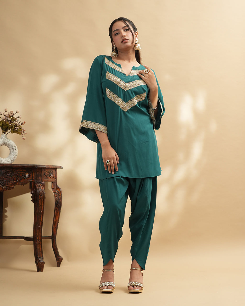 Teal green embellished kurta set with tulip pants