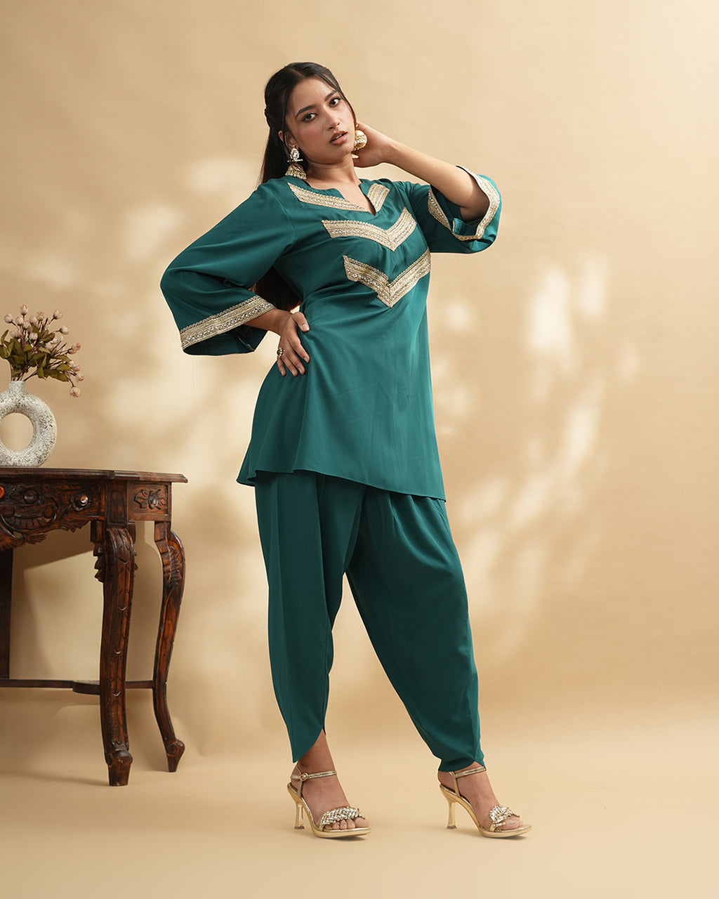 Teal green embellished kurta set with tulip pants