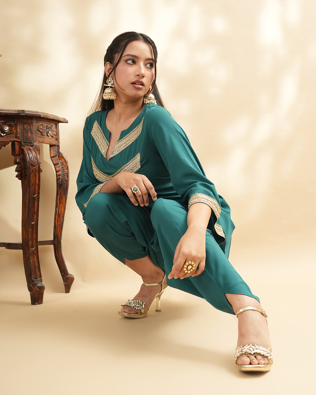 Teal green embellished kurta set with tulip pants