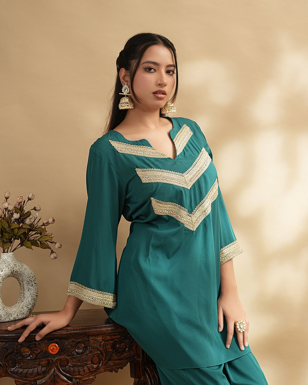 Teal green embellished kurta set with tulip pants