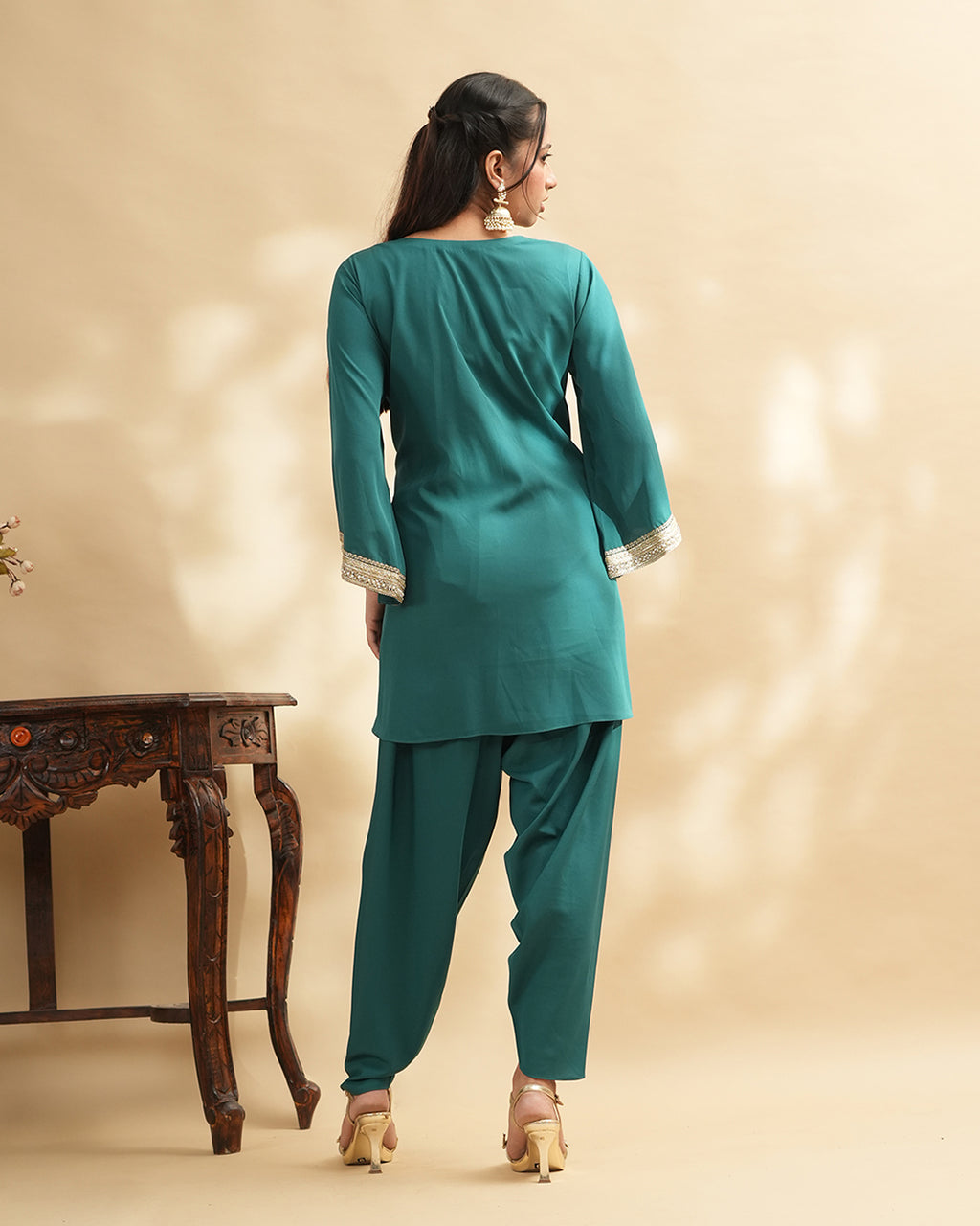 Teal green embellished kurta set with tulip pants