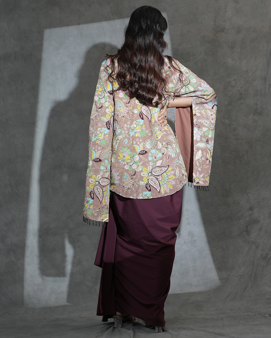 Back view of maroon contemporary draped outfit