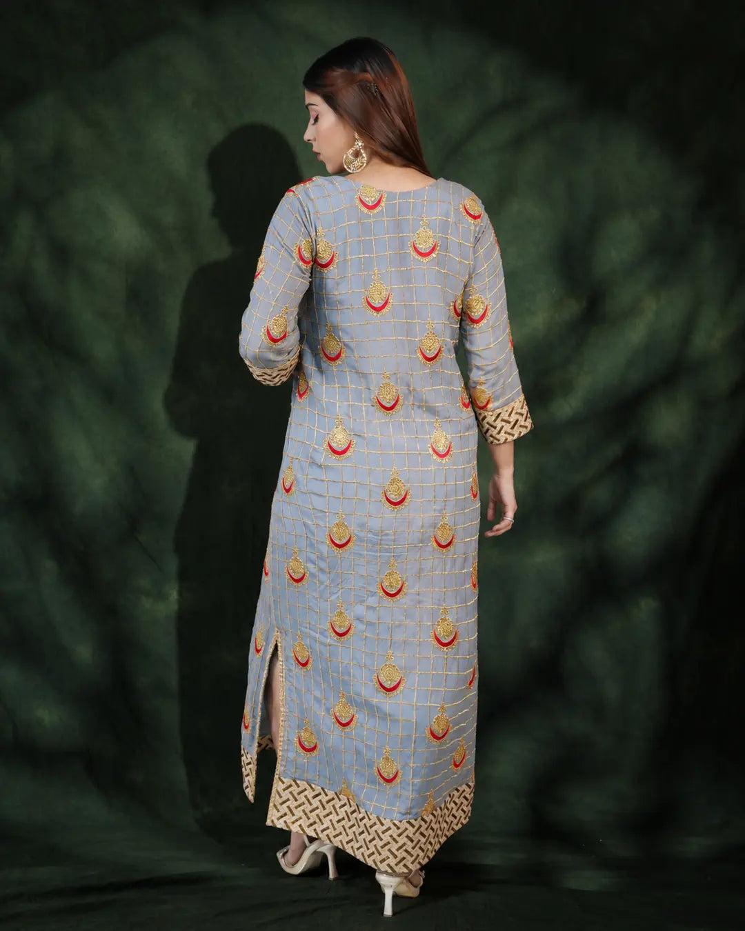Back view of grey long dress with gold embroidery